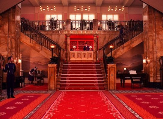 A wide shot of the Grand Budapest Hotel’s lobby.