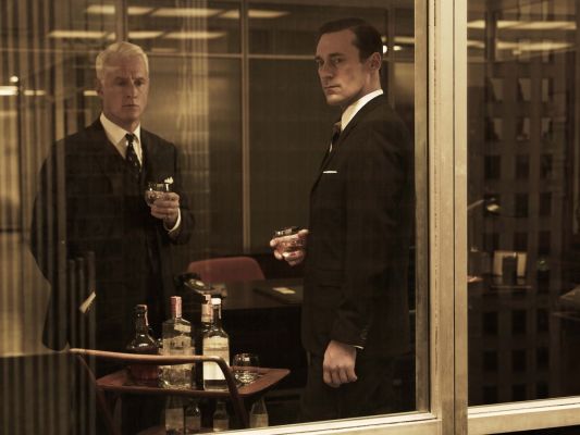 Don Draper and Roger Sterling having a drink together