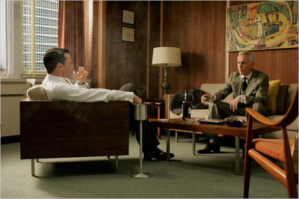 Don Draper and Roger Sterling talking in Draper’s office