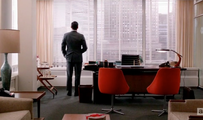 Don Draper staring outside his office window