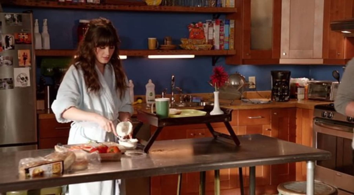 Jess preparing breakfast in the kitchen.