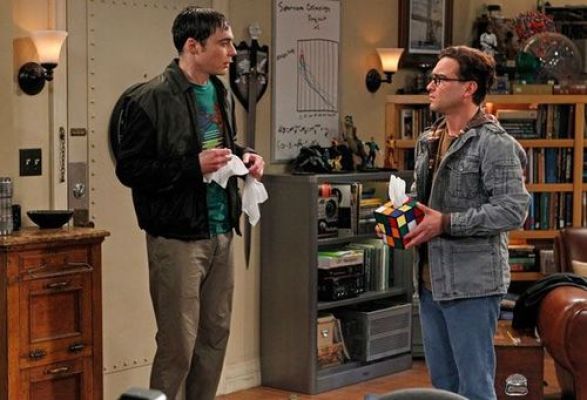 Leonard handing Sheldon tissues.