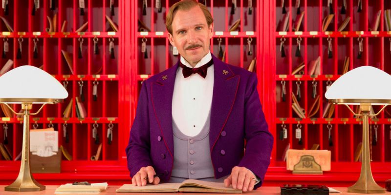 M. Gustave behind the Grand Budapest Hotel’s Concierge desk.